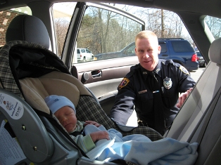 Officer checks an infant seat