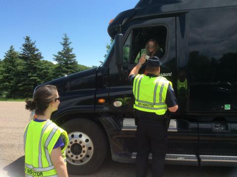 DMV Inspector talking to a truck driver