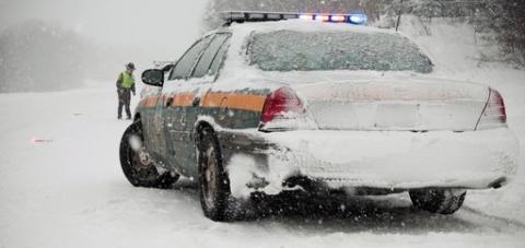 snow covered police car